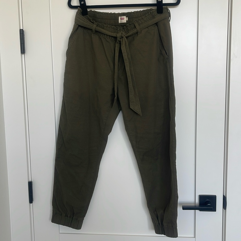 Levi’s olive green paper bag pants with elastic waist and hem